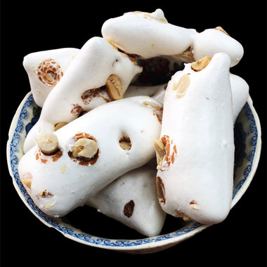 Photo of a bowl of freeze dried almond nougat